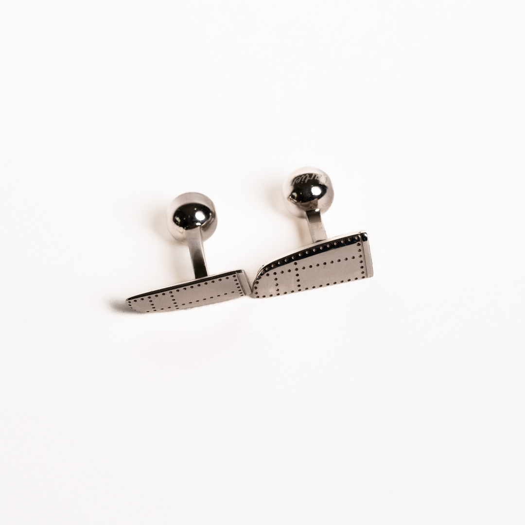 Cartier plane button